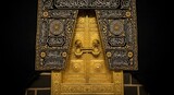 Ornate gold and black door, detailed with intricate Islamic calligraphy, showcasing a rich cultural heritage.