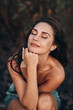 © kinomaster - Contemplative Woman with Natural Beauty Portrait Outdoors