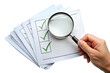 © Borhan - Hand Holding Magnifying Glass Over Checked List on Papers checklist document isolated on a transparent background