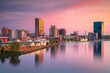 Toledo, Ohio, USA. Aerial cityscape image of downtown Toledo, Ohio with reflection of the skyline in calm Maumee River at beautiful autumn sunrise.