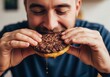© Anna - European man enjoying juicy burger on carnivore diet