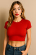 © Jairo - Modern Radiance: A portrait of a young woman embodies effortless style, confidently adorned in a red crop top and stylish jeans, radiating modern elegance against a subtle background.
