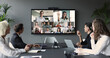© fizkes - Diverse businesspeople, group of professionals take part in videoconference meeting
