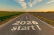 © hiv360 - numbers 2026 and start on asphalt road highway with cracks with sunrise or sunset sky background. concept of destination in future, freedom, work start, run, planning, challenge, target, new year