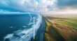 © Georgii - Aerial view of towering wind turbines along the Dutch North Sea coastline at sunset