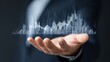 © Mishi Images - Businessman shows virtual graph of real estate growth Ideal for investment property market analysis economic reports or financial development presentation concept