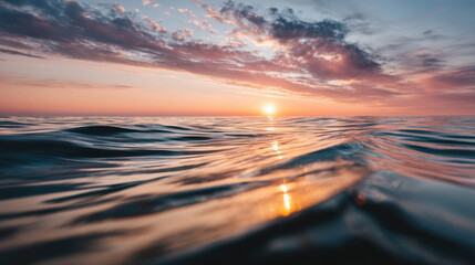 Wall Mural - Serene sunset over ocean creates tranquil atmosphere, with gentle waves reflecting warm colors of sky. horizon blends hues of orange, pink, and blue, evoking sense of peace and beauty
