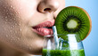 © novirastudio - Close up of a woman drinking a refreshing kiwi smoothie.