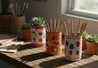 © Ramdhaniyah - Colorful painted cans pencil holders