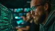 © john - Dedicated IT specialist engages in advanced programming on green mock-up screen in modern data center control room surrounded by professional coding team