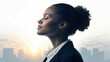 © LOMOSONIC - Young woman in business suit with eyes closed enjoying calm morning sunlight in cityscape background