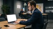 © Saleh - young businessman working on laptop mockup
