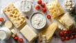 © tulvernax58 - Assorted cheeses and dairy products on a marble surface, with fresh tomatoes and herbs