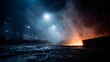 © Thares2020 - Fiery sparks erupt in a dark smoky industrial factory illuminated by glowing heat