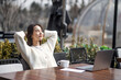 © lijun - Young woman resting in outdoor caf é