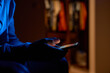 © Lazy_Bear - Close-up of male hands holding smartphone with glowing screen in dark room. Man using smartphone at night. Concept of technology and online communication
