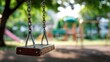 © rini - A solitary swing set with blurred background on sunny day, inviting childhood nostalgia