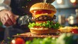 © Alif - Professional chef adds the finishing touches to a tall, juicy gourmet cheeseburger with fresh ingredients in a restaurant kitchen