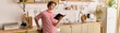 © LIGHTFIELD STUDIOS - Young man engages in online learning from stylish apartment kitchen space