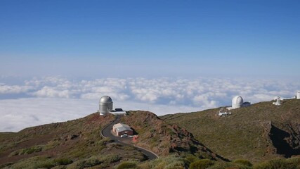 Wall Mural - Telescopes of the Roque de los Muchachos Observatory on La Palma island above a sea of clouds