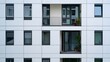 © Praant - Modern apartment building facade with balconies and windows in a geometric pattern design