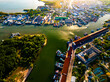 Aerial view of residential houses and driveways neighborhood during a fall sunset or sunrise time.Tightly packed homes.Top view over building houses in phuket thailand
