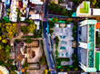 Aerial view of residential houses and driveways neighborhood during a fall sunset or sunrise time.Tightly packed homes.Top view over building houses in phuket thailand
