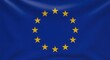 © srie - European Union flag waving prominently against a blue background with gold stars emblem
