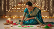 © PRASANNAPIX - young indian woman making flower rangoli on diwali festival