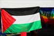 gazebo during a demonstration with big Palestine Flag and the colorful flag with text PACE that means PEACE in Italian language