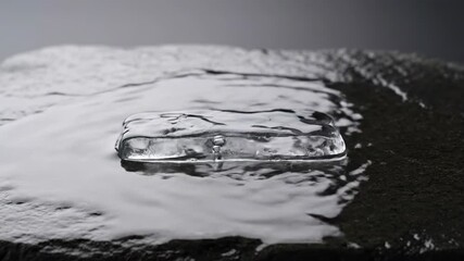 Wall Mural - ﻿Timelapse of a large ice block slowly melting and disappearing, revealing the surface beneath disappearing, slowly melting, frozen