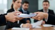 © Letcia - Close-up of hands exchanging important documents in a professional office setting.