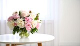 Bouquet of peonies on white table