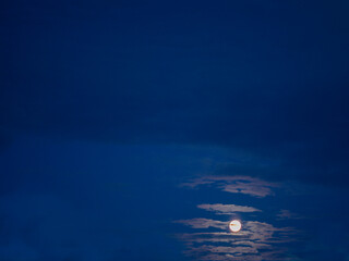 Wall Mural - Blue night sky with a few clouds and round mood. Nature scene.