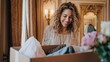 © Justlight - Medium shot of a customer excitedly unpacking a milestone celebration subscription box with elegant party wear the chic clothing pieces prominently in focus while the surroundings