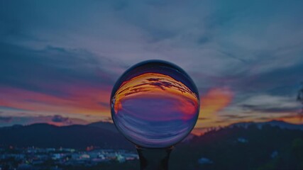 Wall Mural - Time lapse View of colorful nature at sunset inside crystal balls.
beautiful cloud in sky over sea in a crystal ball on the beach. 
Nature High quality footage in nature and travel concept.