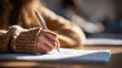 © Dimas - World Student’s Day student writing exam in classroom focusing on study, education, academic achievement, knowledge, and future learning success