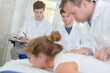 © auremar - Students learning from a doctor
