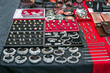 Jewelry made of animals teeth and skin sold on city street. Various handicraft souvenir, soft selective focus