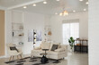 © New Africa - Stylish living room with lamp, houseplant and sofa. Interior design
