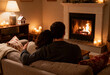 © Wang - Couple sitting on sofa, fireplace glowing, candles lit.