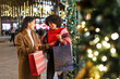 © Jordi Mora - Diverse women friends enjoying christmas holiday shopping