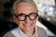 © Westend61 - Confident smiling woman with glasses in cafe showing self assurance