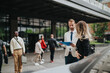 © qunica.com - A group of diverse business individuals engaging in discussions outside a contemporary office space