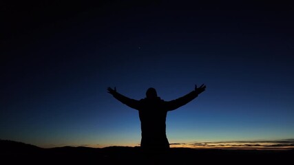 Wall Mural - Man with arms wide open enjoying outdoors under stars, planets and Moon.