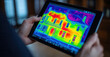 © vasyl pshyk - Thermal imaging device displays heat patterns of a historic house during an energy audit in bright colors