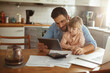 © Geber86 - Father and daughter using tablet at home
