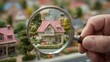 © Nice Seven - A hand holding a magnifying glass reveals a detailed miniature house surrounded by greenery, showcasing craftsmanship in model-making.