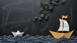 © Hector - Leadership banner concept with paper boat on blackboard background. One leader ship leads others
