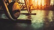 © AizayStock - Close-Up of Gym Equipment in Soft Light at Sunset in Fitness Studio